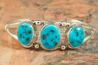 3 Beautiful Genuine Sleeping Beauty Turquoise Stones set in Sterling Silver Bracelet. The Sleeping Beauty Turquoise mine is located in Gila County, Arizona. Created by Navajo Artist Arkie Nelson. Signed by the artist.